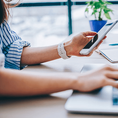 Women on laptop and mobile